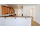 Kitchen featuring wood cabinets, granite countertops and a breakfast bar at 29270 W Weldon Ave, Buckeye, AZ 85396