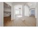 Open-concept living room showcases wood-look floors and bright, airy atmosphere at 29270 W Weldon Ave, Buckeye, AZ 85396