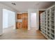 Open living room featuring wood floors and modern cabinets at 29270 W Weldon Ave, Buckeye, AZ 85396