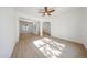Spacious living room features light-filled open space and light wood-look floors at 29270 W Weldon Ave, Buckeye, AZ 85396