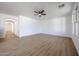 Spacious living room featuring neutral walls, ceiling fan, and tile flooring at 29270 W Weldon Ave, Buckeye, AZ 85396