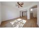 Spacious living room features modern ceiling fan and light-filled space at 29270 W Weldon Ave, Buckeye, AZ 85396