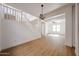 Spacious living room features staircase with light wood-look floors throughout at 29270 W Weldon Ave, Buckeye, AZ 85396