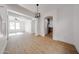 Bright living room featuring modern light fixture and light wood-look floors at 29270 W Weldon Ave, Buckeye, AZ 85396