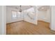 Bright living area with wood-look floors and a staircase, perfect for entertaining at 29270 W Weldon Ave, Buckeye, AZ 85396