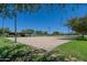 A sand volleyball court surrounded by lush greenery, perfect for outdoor recreation at 29270 W Weldon Ave, Buckeye, AZ 85396