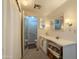 Well-lit bathroom with vanity, mirror, and shower at 2929 E Main St # 471, Mesa, AZ 85213