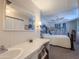 Well-lit bathroom with vanity, mirror, and view to bedroom at 2929 E Main St # 471, Mesa, AZ 85213