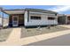 Charming home featuring well-maintained landscaping, and a sidewalk leading to the front door at 2929 E Main St # 471, Mesa, AZ 85213