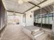 Enclosed sunroom patio featuring a ceiling fan, hot tub and access to an additional screened-in area at 2929 E Main St # 471, Mesa, AZ 85213