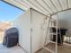 Exterior view of a white metal storage shed under an awning, featuring a sturdy ladder at 2929 E Main St # 471, Mesa, AZ 85213
