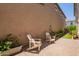 Cozy backyard with paved patio and decorative potted plants at 2947 N Sonoran Hls, Mesa, AZ 85207