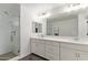 Bright bathroom with a glass enclosed shower and a double vanity at 2947 N Sonoran Hls, Mesa, AZ 85207