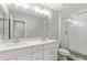 Bright bathroom with a glass enclosed shower and a double vanity at 2947 N Sonoran Hls, Mesa, AZ 85207