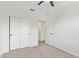 Bedroom featuring ample closet space and neutral carpet at 2947 N Sonoran Hls, Mesa, AZ 85207