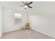 Bright, minimalist bedroom with a chair and a window at 2947 N Sonoran Hls, Mesa, AZ 85207