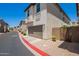 Exterior view of a home with a two-car garage and well maintained landscaping at 2947 N Sonoran Hls, Mesa, AZ 85207
