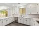 Modern kitchen featuring white cabinetry, stainless steel appliances, and quartz countertops at 2947 N Sonoran Hls, Mesa, AZ 85207
