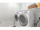 Convenient laundry room featuring a modern, white washer and dryer set at 2947 N Sonoran Hls, Mesa, AZ 85207