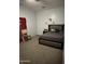 A spacious bedroom with a cozy bed, carpet floors, and decorations on the wall at 29935 W Roosevelt St, Buckeye, AZ 85396