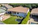 Aerial view of backyard with artificial turf, trampoline, and outdoor living spaces at 3030 E Camellia Dr, Gilbert, AZ 85296
