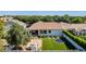 Aerial view of the backyard with outdoor kitchen, trampoline, and covered patio at 3030 E Camellia Dr, Gilbert, AZ 85296