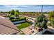 Beautiful backyard featuring artificial grass, brick patio with fireplace, and private gazebo, perfect for outdoor living at 3030 E Camellia Dr, Gilbert, AZ 85296