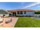 Nice backyard with artificial turf, patio, trampoline, and exterior view of the home at 3030 E Camellia Dr, Gilbert, AZ 85296