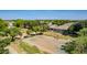Aerial view of the basketball court in a residential neighborhood, surrounded by trees at 3030 E Camellia Dr, Gilbert, AZ 85296