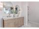 Elegant bathroom featuring a double vanity, marble countertop, and modern lighting at 3030 E Camellia Dr, Gilbert, AZ 85296