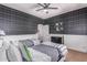 Shared bedroom with fun wallpaper, wood trim, and coordinated twin beds at 3030 E Camellia Dr, Gilbert, AZ 85296