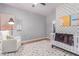 Cozy Bedroom with a colorful rug and a white crib against an accent wall at 3030 E Camellia Dr, Gilbert, AZ 85296