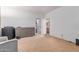 Bright bedroom with a large dresser and an open door to the bathroom at 3030 E Camellia Dr, Gilbert, AZ 85296