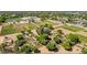 Expansive community garden featuring individual plots, shaded structures, and a variety of plants and vegetables at 3030 E Camellia Dr, Gilbert, AZ 85296