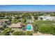Community pool and tennis courts surrounded by lush greenery, offering residents recreational opportunities at 3030 E Camellia Dr, Gilbert, AZ 85296