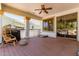 Inviting covered patio with ceiling fan, wood deck, BBQ, and outdoor seating at 3030 E Camellia Dr, Gilbert, AZ 85296