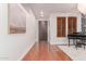 Elegant entryway featuring hardwood floors, dark wood accents, and sophisticated decor, creating a welcoming ambiance at 3030 E Camellia Dr, Gilbert, AZ 85296