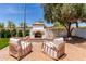 Outdoor fireplace with comfortable seating, ideal for relaxing evenings at 3030 E Camellia Dr, Gilbert, AZ 85296