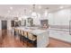 Bright kitchen featuring a large island with bar seating and modern pendant lights at 3030 E Camellia Dr, Gilbert, AZ 85296