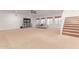 Expansive living room with staircase, TV, and a comfortable sofa at 3030 E Camellia Dr, Gilbert, AZ 85296