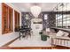 Refined living area with a grand chandelier, stylish wallpaper, and plush seating, perfect for elegant entertaining at 3030 E Camellia Dr, Gilbert, AZ 85296