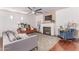 Comfortable living room with a fireplace, plush seating, and a stylish area rug at 3030 E Camellia Dr, Gilbert, AZ 85296