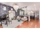 Open-concept layout with a grand mirror, elegant furnishings, and seamless flow to the kitchen, perfect for modern living at 3030 E Camellia Dr, Gilbert, AZ 85296