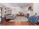 Spacious living room featuring fireplace, ceiling fan, and hardwood flooring at 3030 E Camellia Dr, Gilbert, AZ 85296