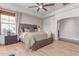 Comfortable main bedroom with decorative wallpaper, wood flooring, and neutral tones at 3030 E Camellia Dr, Gilbert, AZ 85296