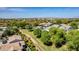 Scenic aerial view of neighborhood with lush green landscaping, pools, and well-maintained homes at 3030 E Camellia Dr, Gilbert, AZ 85296