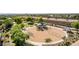 Community playground featuring swings, climbing structures, and a soft, sandy base for safe play at 3030 E Camellia Dr, Gilbert, AZ 85296