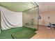 Recreation room features a golf simulator and exercise equipment at 3030 E Camellia Dr, Gilbert, AZ 85296