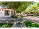 Picturesque street view featuring lush trees lining the sidewalk, highlighting the neighborhood's charm and appeal at 3030 E Camellia Dr, Gilbert, AZ 85296