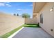 Private backyard features artificial turf, concrete patio, block fence, and outdoor lighting at 3113 E Danbury Rd # 10, Phoenix, AZ 85032